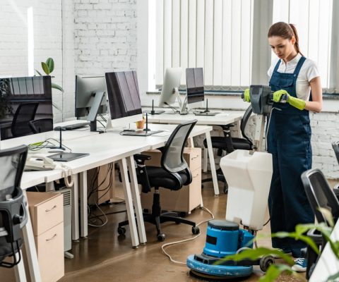 Young,Cleaner,Washing,Floor,In,Open,Space,Office,With,Cleaning